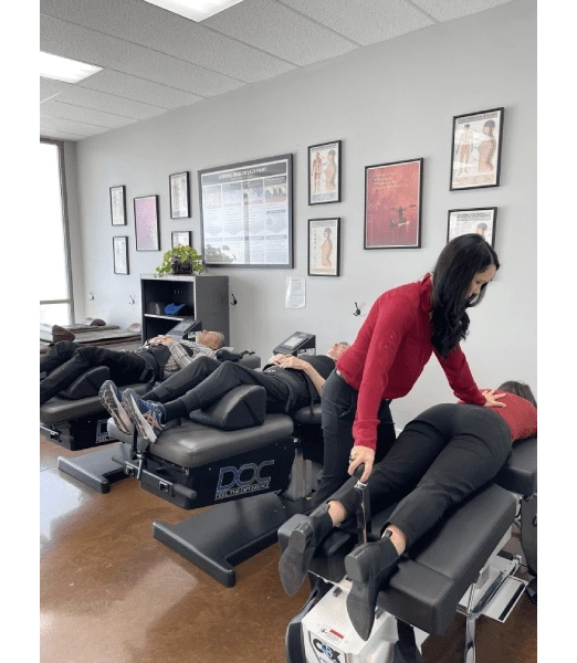 Chiropractor Valencia CA Carolyn Griffin Adjusting On Table